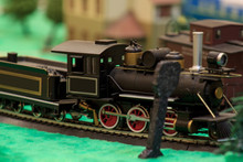 The Old Steam Locomotive Carries The Freight Train. Toy Railroad.