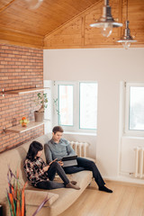 Two young students preparing for exams in apartment interior