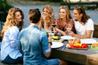 © puhhha - Happy Friends In Outdoor Picnic Party Having Fun
