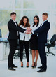 © ASDF - Group of business people piling up their hands together