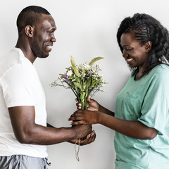 Wall Mural - Wife receives a bouquet of flowers from her husband