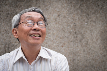 Wall Mural - happy old man looking up, smiling senior thinking, positive retired pensioner portrait