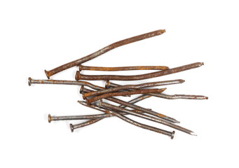 Pile of old, rusty metal nails isolated on white background, top view