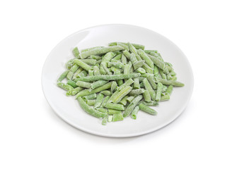 Wall Mural - Frozen green beans on dish on a white background