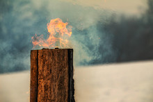 Swedish Torch Fire Burning Stub On Plate For Rest And For Warming In Winter