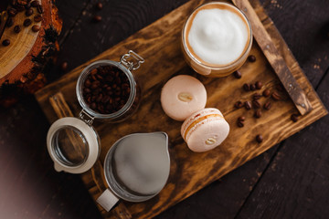  Coffee. Top view, breakfast. Coffee latte with croissants lie on a wooden tray.