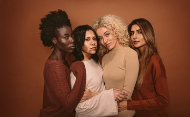 Wall Mural - group of beautiful female friends standing together