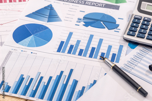 Financial Development Calculator And Pen On Chart And Graph Paper Financial Development Calculator And Pen On Chart And Graph Paper