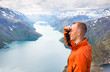 © lkoimages - Sport couple hiking on Besseggen. Hikers enjoy beautiful lake and good weather in Norway.