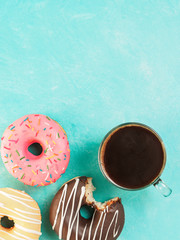 Wall Mural - donuts on blue background , copy space, top view