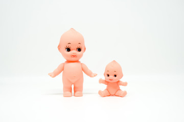 Couple of cute naked dolls on white isolated background.