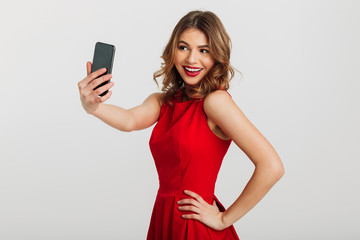 Sticker - Portrait of a pretty young woman dressed in red dress