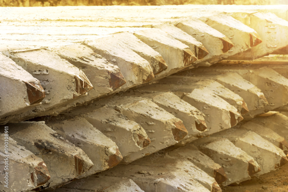 Foto de Stock Stack of prestressed concrete piles on ground for ...