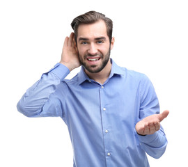 Wall Mural - Young man with hearing problem on white background