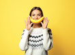 © Africa Studio - Funny portrait of young woman with banana on color background
