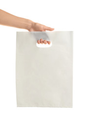 Wall Mural - Woman holding bag on white background. Mockup for design