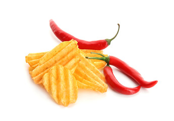 Potato chips and chili peppers on white background