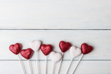 Decorative Red And White Hearts Over White Wooden Background