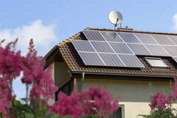 Wall Mural - rooftop with solar panels and blue sky