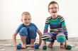 © galitsin - Children train with dumbbells. The concept of sport in the family.