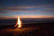© Natasha Lee - Beach bonfire at sunset by ocean in Nicaragua