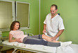 © dobok - Magnet therapy. Physical therapist treating patient knee