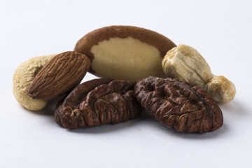 Wall Mural - Mixed nuts isolated on a white background