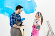 © LIGHTFIELD STUDIOS - smiling boyfriend and girlfriend looking at each other and making repairs