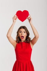 Poster - Portrait of a surprised young woman dressed in red dress