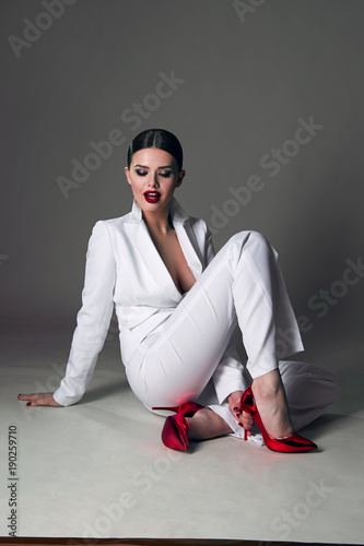 white suit red shoes