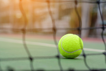 Wall Mural - Blur net tennis on ball and court background