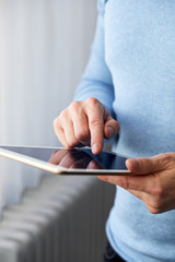 Wall Mural - male hand presses on screen digital tablet