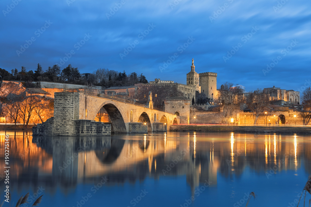 View on Pont d'Avignon 12th century bridge and city skyline reflecting in water at dusk in Avignon, Provence, France - obrazy, fototapety, plakaty 