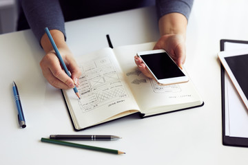 Wall Mural - close up of woman sketching graphic sketch in office