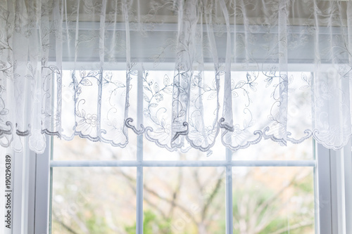 Closeup Of Small Short Lace White Window Curtains Blinds In Bright