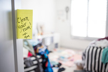 "Clean Your Room" Note From Mom On Door Of Messy Room