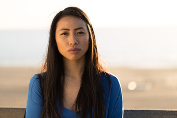 Wall Mural - Young Asian woman serious face 