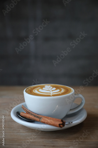 Fotomural cappuccino or Latte art coffee made from milk on the wood table in coffee shop