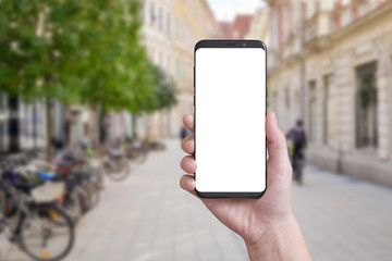 Smart phone in woman hand on city streets. Isolated screen for mockup, app design presentation.