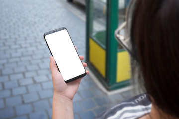 Poster - Woman use mobile phone with round edges on city streets. Isolated white screen for mockup.
