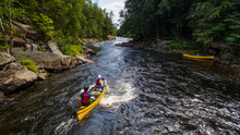 Group Of People Paddling The Whitewater Of The Noire River In Quebec, Canada.