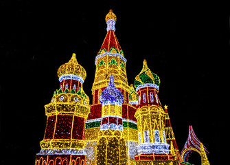 Bright lights decoration in form of Saint Basil's Cathedral (Sobor Vasiliya Blazhennogo, Cathedral of Vasily the Blessed) in evening Moscow