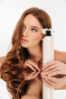 © Drobot Dean - Vertical Beauty portrait of ginger woman with flower in hair