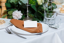 Wedding Table Setting With Blank Guest Card, Napkin, Succulent And Dish On A Wooden Plate. Rustic Decor In Brown Tones