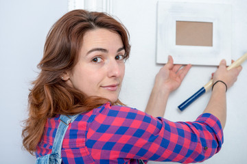 Wall Mural - young woman doing DIY work at home