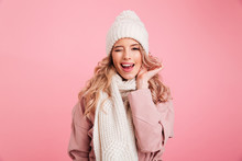 Happy Young Woman Wearing Warm Scarf. Looking Camera.
