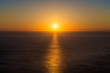 Beautiful sunset over the sea in the Atlantic ocean. Solar path on the sea like a wide band of molten gold on top of the water