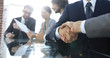 © ASDF - handshake of business partners in conference room