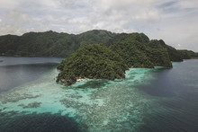 High Angle Scenic View Of Islands In Sea Against Cloudy Sky