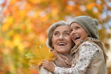 grandmother and granddaughter hugging